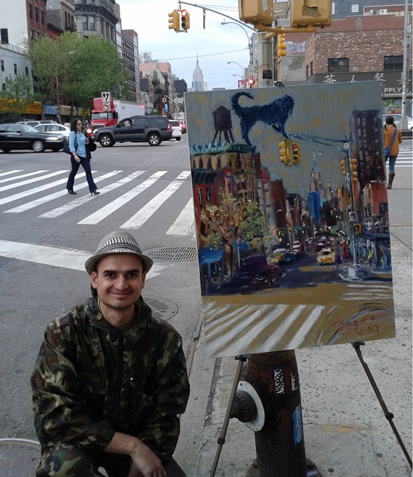 Художник Роман Ромулен (Рахматулин)  со своей картиной, на которой изображен любимый персонаж Синий Пес